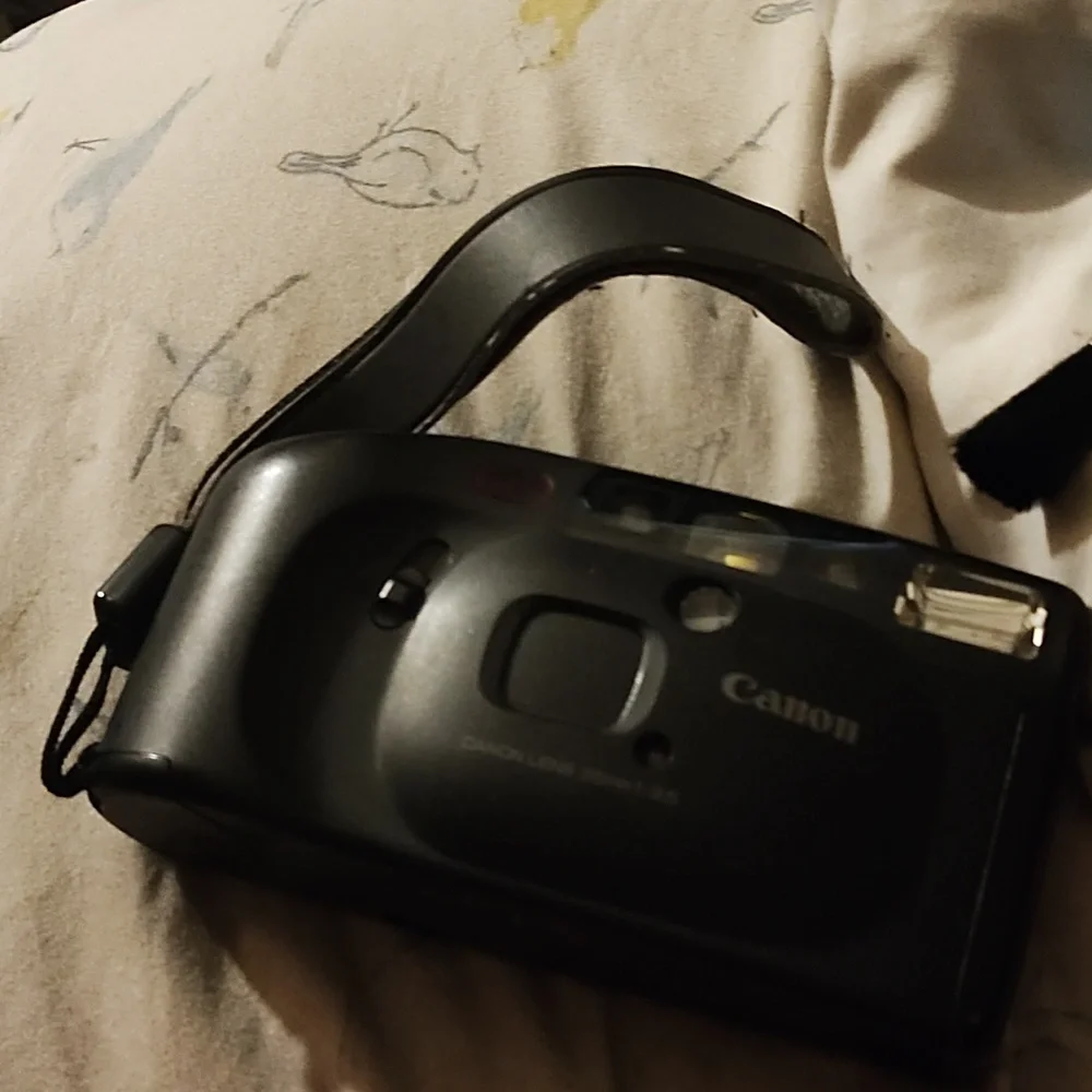 Vintage Canon camera and Canon bag with brush cleaner